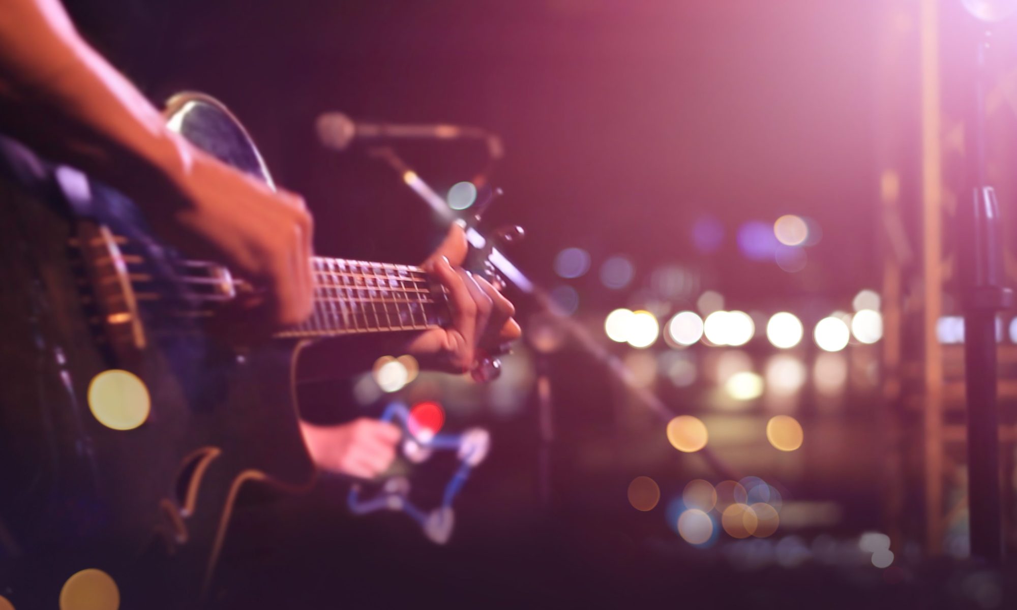 Guitarist on stage for background, soft and blur concept