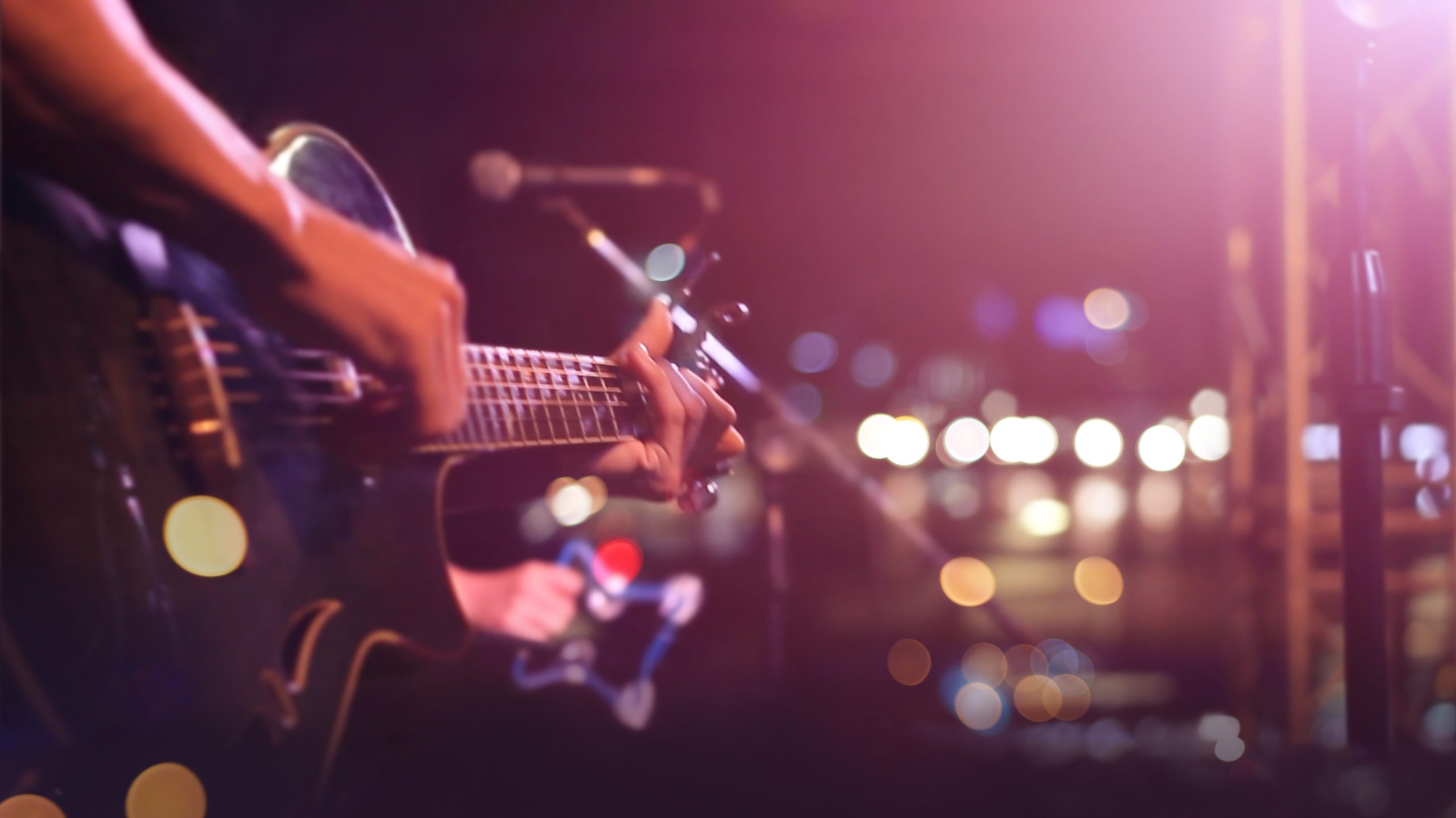 Guitarist on stage for background, soft and blur concept